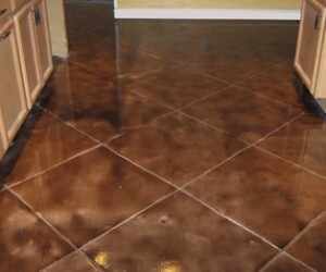 A kitchen floor with large, glossy brown tiles arranged diagonally, reflecting light from above. Light-colored cabinets line the sides of the room, while USDA approved flooring ensures safety and hygiene throughout the space. A kitchen floor with large, glossy brown tiles arranged diagonally, reflecting light from above. Light-colored cabinets line the sides of the room, while USDA approved flooring ensures safety and hygiene throughout the space.